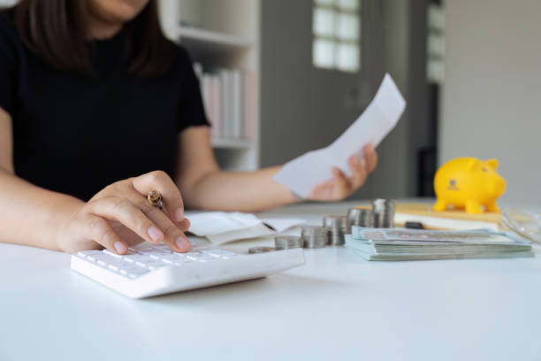 istock Man using calculator and calculate bills in home office. saving money concept 1675852401