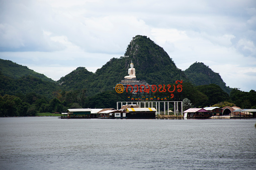 View landscape Si Sawat or Khwae Yai river and house home resort hotel homestay on rafting with buddha on mountain for thai people travelers travel visit on August 30, 2023 in Kanchanaburi Thailand