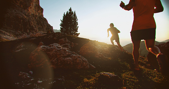 Two men trail running on mountain: the Dolomites