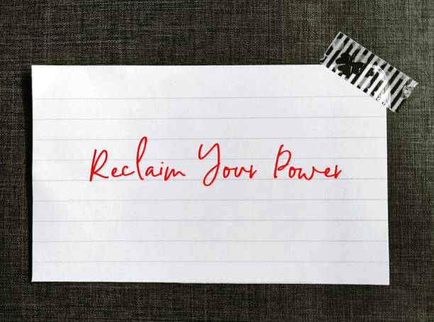istock Note stick on wall with handwritten text Reclaim Your Power, self talk affirmation to encourage people who  tired of feeling stuck in career or relationship, to reclaim your power and reinvent life 1675873061