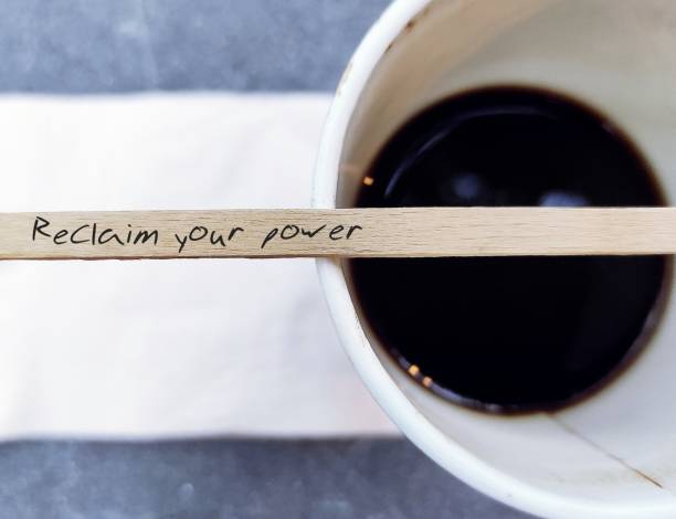 istock Wood coffee stirrer with handwritten text Reclaim Your Power, self talk affirmation to encourage people who  tired of feeling stuck in career or relationship, to reclaim your power and reinvent life 1675873065
