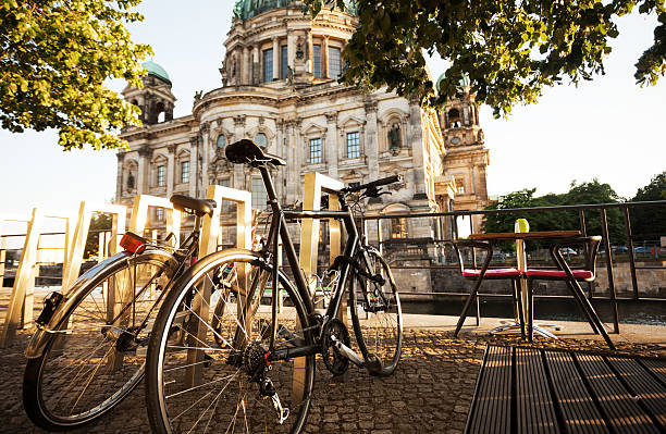 city cycle commuting two bicycles in Berlin, city commuting spree river photos stock pictures, royalty-free photos & images
