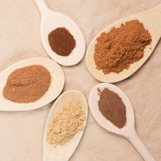 istock Spoons in a circle or flower shaped pattern, filled with ground spices to make pumpkin pie spice blend. 1675892120