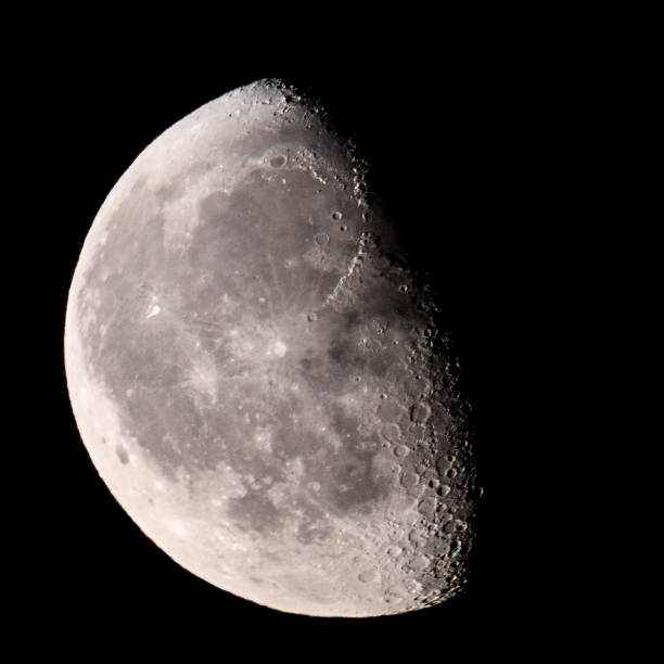 istock Moon with a clearly visible moon surface in the dark night sky. 1675901443