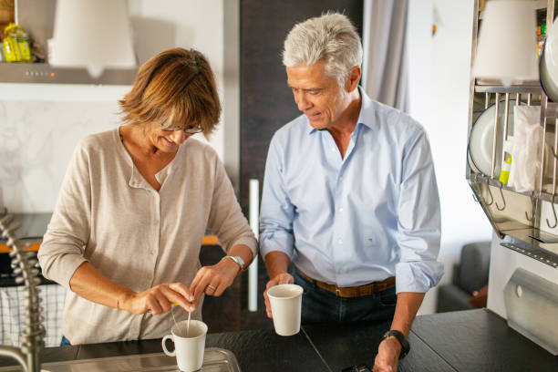 istock older couple preparing cup of tea in kitchen 1675915098