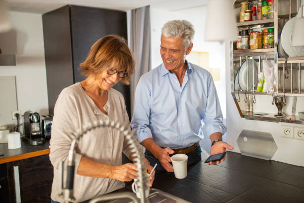 istock older couple smiling in kitchen 1675915133