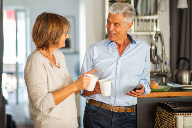 istock older man and woman with talking with cup of tea 1675915134