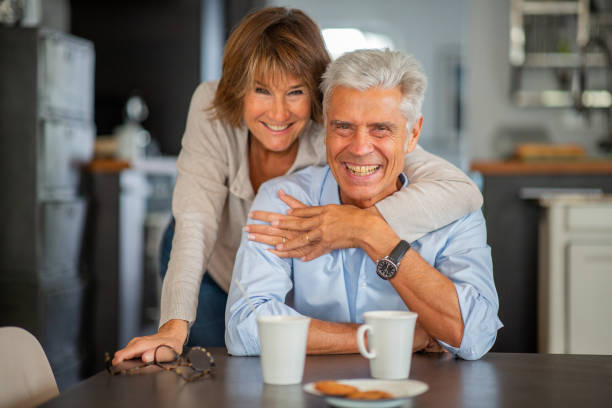 istock loving older couple smiling at home 1675915713