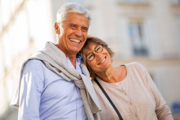 istock Close up portrait smiling older couple outside 1675915742