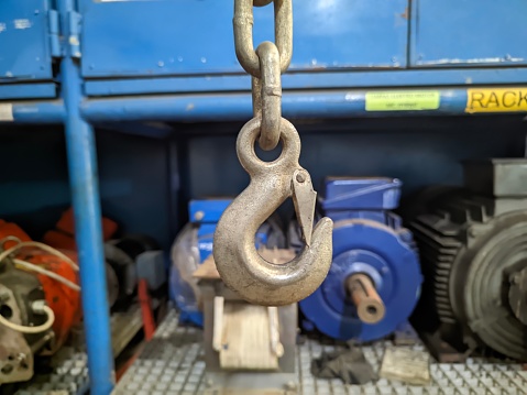 hook of hydraulic lift in a workshop