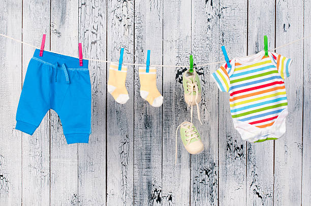 istock Baby clothes hanging on the clothesline. 167594038