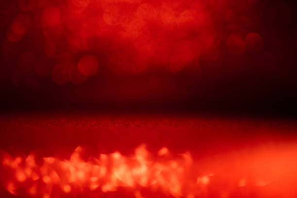 Vibrant Red Abstract Bokeh Background with Glowing Light Spots for Creative Designs