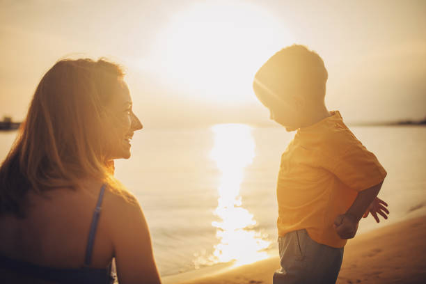 istock Mother and son by the sea 1675965959