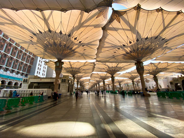 Giant umbrellas at Nabawi Mosque, Medina Saudi Arabia stock photo