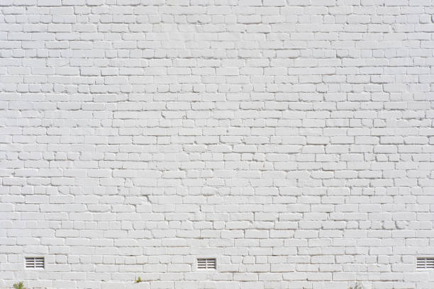 Part of an old white brick wall
