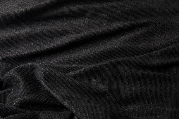 istock Smooth shiny fabric texture with folds and wawes. Close up silk background 1675971522