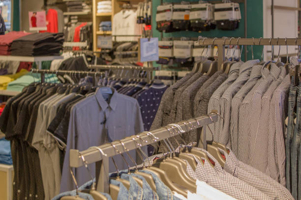 istock Man casual clothes hanging in the store 1675972094