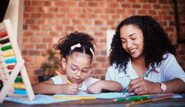 istock Smile, mother and girl with homework, help and conversation with education, growth and learning advice. Family, parent or female kid writing in a lounge, notebook and knowledge with child development 1675972635