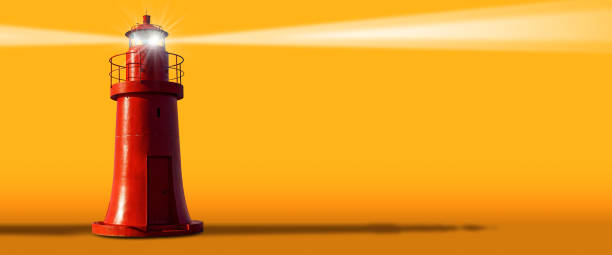 istock Red Lighthouse with Light Beams on a Yellow and Orange Background 1675983245