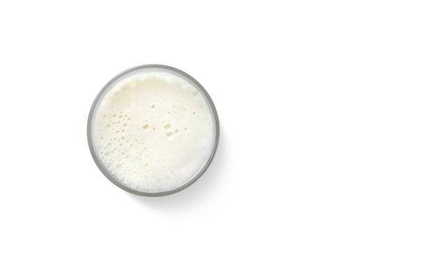 istock Milk foam in a glass. Top view isolated on white background. 1675995974