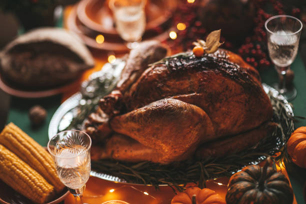 istock Thanksgiving holiday dinner table setting with fall decoration and pumpkins 1676002499