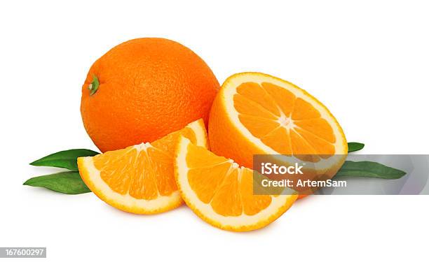 Ripe Oranges And Two Slices With Green Leaves Stock Photo - Download Image Now