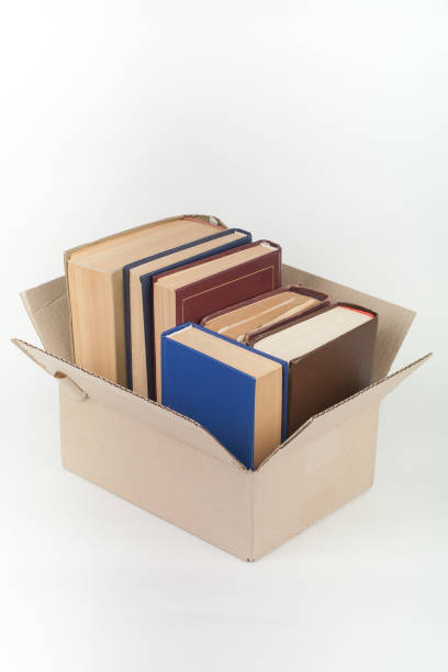 Open books on wooden deck table and white background. Back to School. Education concept with copy space for your ad text