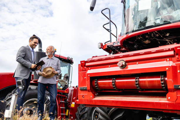 istock Selling tractors and combine harvester at dealership. 1676017724