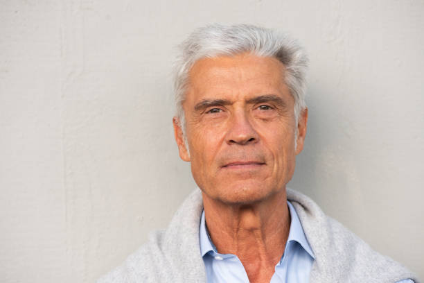 istock Close up serious older man against white wall 1676039187