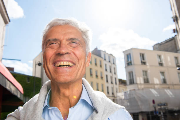 istock Close up smiling older man in city 1676040283