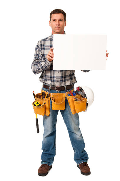 建設請負業者カーペンター、ブランクサインに分離白背景 - manual worker full length isolated on white standing ストックフォトと画像