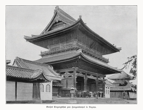 Historical view of the main entrance of Hongan-ji Nagoya Betsuin - a Jōdo Shinshū Buddhist temple located in Naka ward, Nagoya in central Japan. It dates back to about 1500 CE. The wooden building and artwork were largely destroyed during the bombing of Nagoya in World War II in May 1945. It was rebuilt in a Mauryan Dynasty ancient Indian style. Halftone print after a photograph, published in 1900.