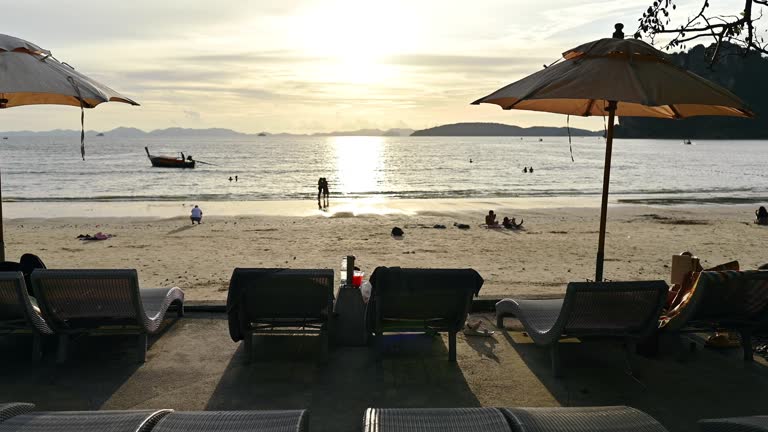 Sunset Vacation activity people enjoy summer traveling at asia beach front chair with infinity swimming pool on a tropical beach railay krabi thailand