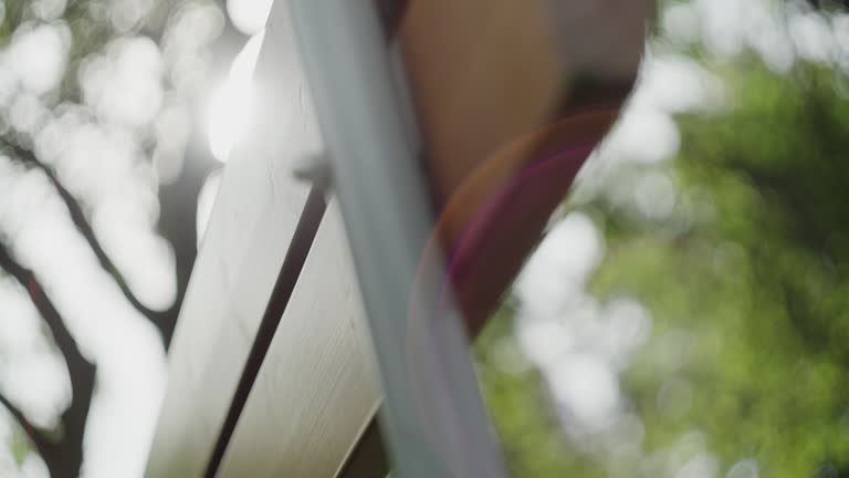 Park bench in a public park on a summer day, close up on the details