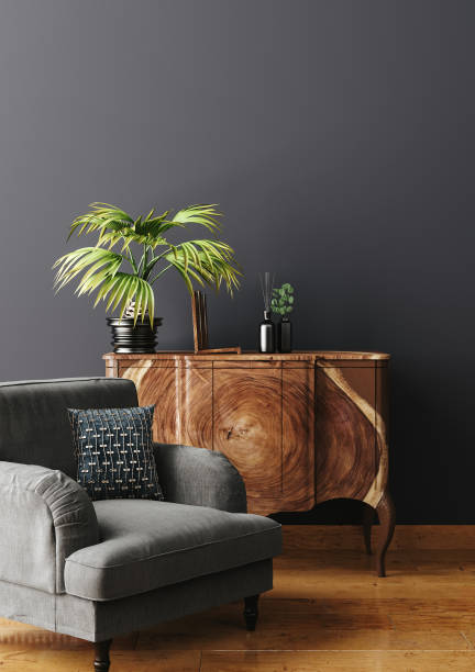 istock Commode with armchair and decor in living room interior, dark blue wall mock up background 1676079250