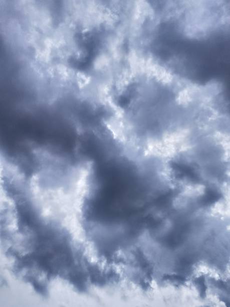 istock Clear Human Face Visible in the Giant  grey cumulonimbus clouds 1676084158