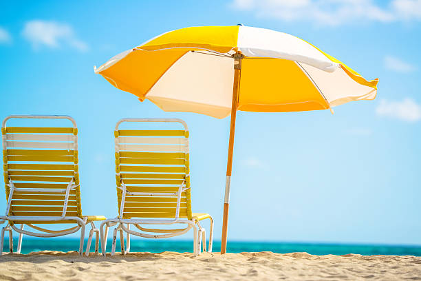 Beach Paradise Beach Paradise beach umbrella stock pictures, royalty-free photos & images