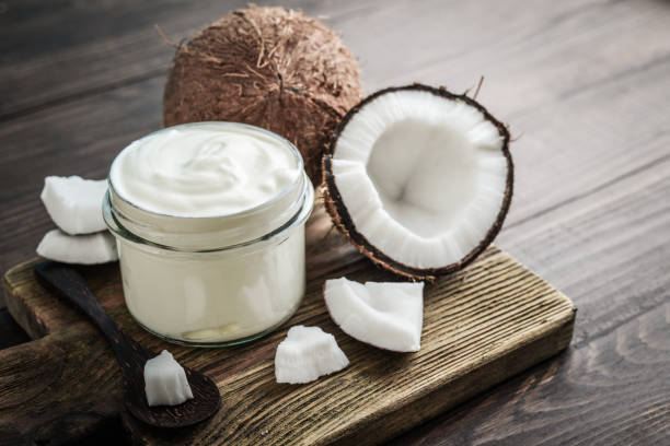 istock Coconut cream in a glass jar with fresh coconut 1676097411