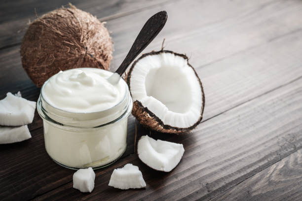 istock Coconut cream in a glass jar with fresh coconut 1676097612