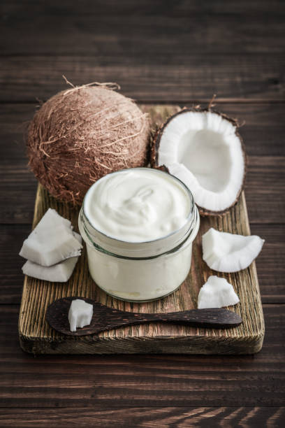 istock Coconut cream in a glass jar with fresh coconut 1676097614