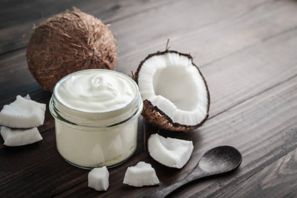 istock Coconut cream in a glass jar with fresh coconut 1676097621