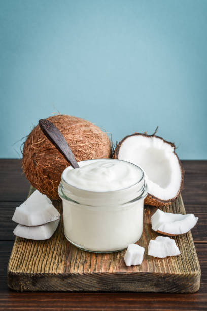 istock Coconut cream in a glass jar with fresh coconut 1676097626