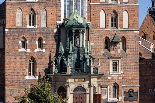 Krakow, Poland - September 6, 2023: Medieval gothic red brick St. Mary's church at Main Square in the Old Town