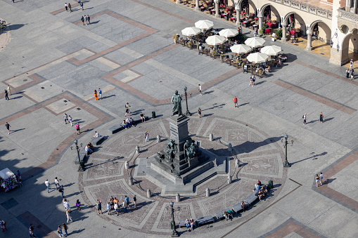 Krakow, Poland - September 9, 2023: Aerial view from tower of St. Mary's Church of polish poet Adam Mickiewicz Monument and Cloth Hall (Sukiennice)