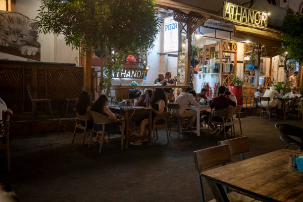 Dahab, Egypt - July 10, 2023: People eat dinner outdoors on a warm summer night in Dahab,.