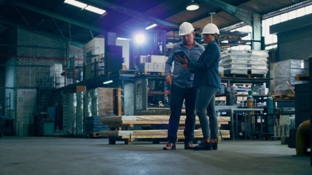 istock Freight, tablet and conversation with warehouse, shipping and manufacturing planning with worker. Factory, logistics and delivery information at plant with employee and supply chain collaboration 1676137829