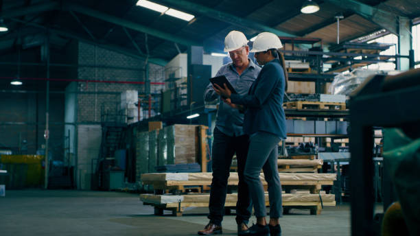 istock Freight tablet, worker teamwork and conversation with warehouse, shipping and manufacturing planning. Factory staff, logistics and delivery with export employee and supply chain collaboration 1676137830