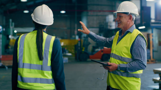 istock Freight, manager and conversation with warehouse, shipping and manufacturing planning with tablet. Factory, logistics and delivery information at plant with employee and supply chain collaboration 1676138346