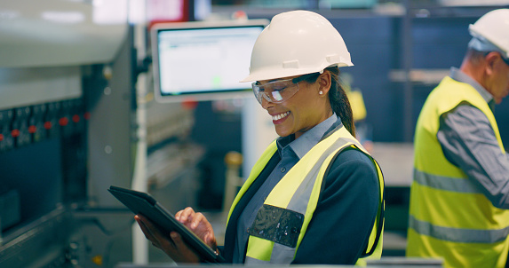 Smile, engineering and woman with a tablet, connection and  update software with electrician, network and website information. Person, employee or supervisor with tech, industrial and search internet