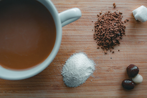 Granulated coffee ingredients and coffee, milkpowder, sugar, mug, sweets